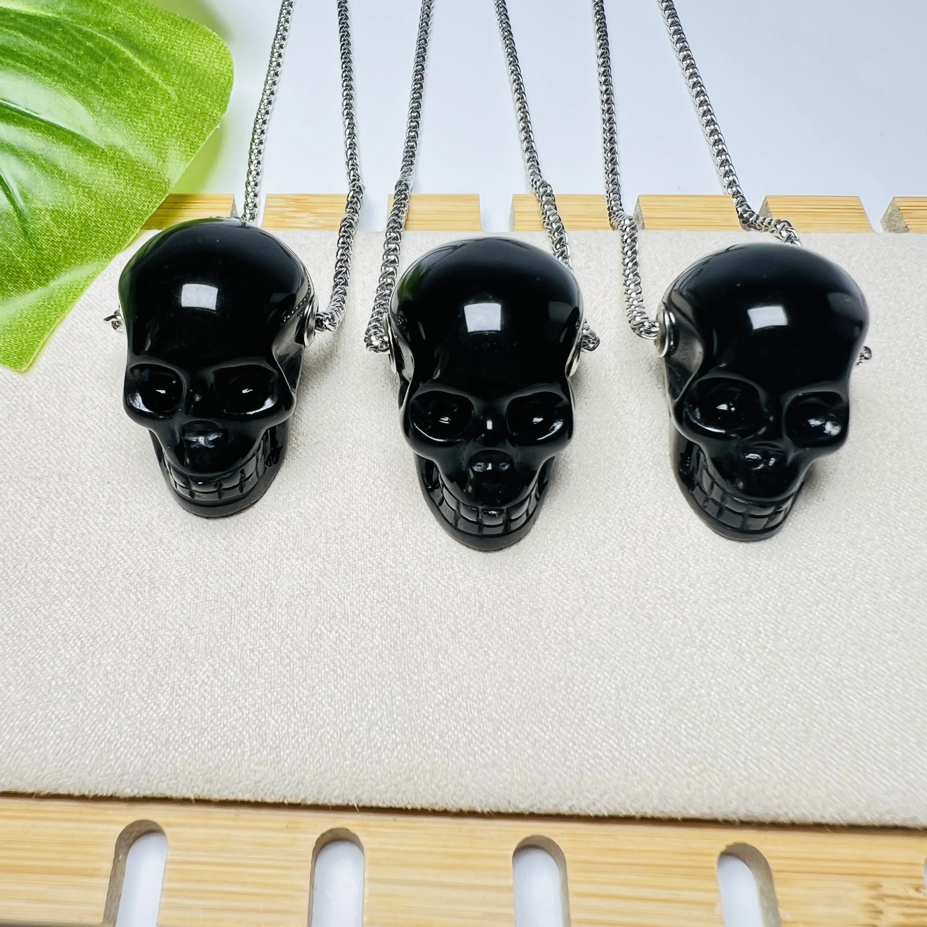 Bulk wholesale high quality hand carved natural black Obsidian crystal skulls pendant for decoration