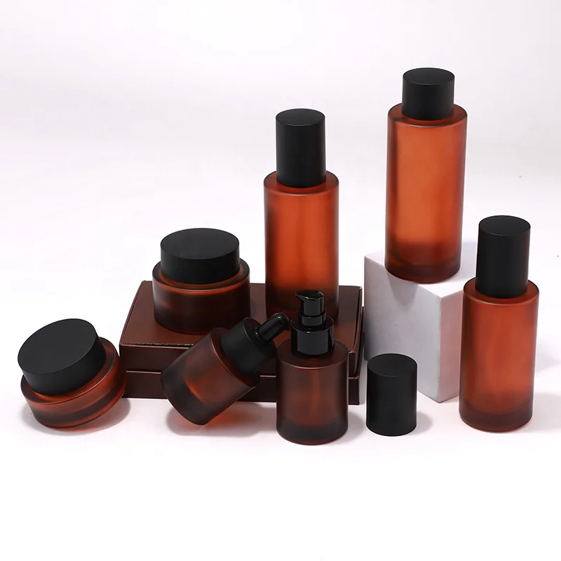 New Arrival Cosmetic Skincare Packaging Lotion Pump Bottle and Cream Jar Oil Dropper Toner Glass with Brown Frosted Amber Color