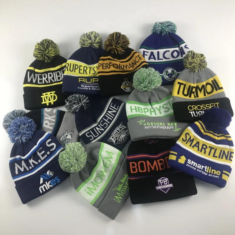 Knitted Jacquard and Embroidery Logo on cuff man and woman Beanie hats with pompom winter hat keep warmth hat beanie supplier