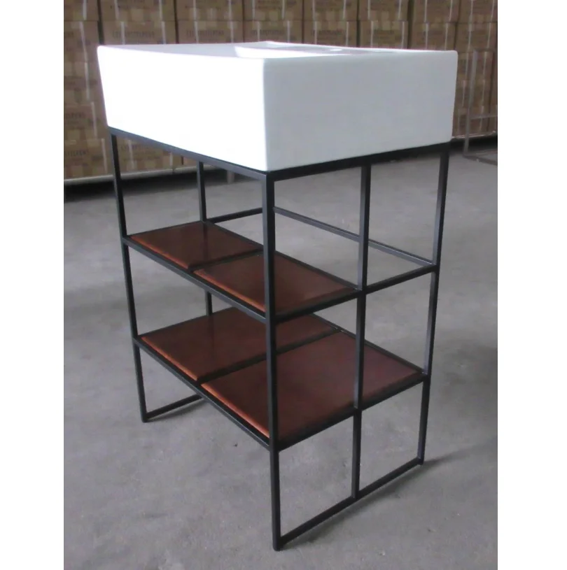 Steel and hampered copper apron bathroom vanity bases Carrara marble counter top  black round tubing washstand floating sink leg