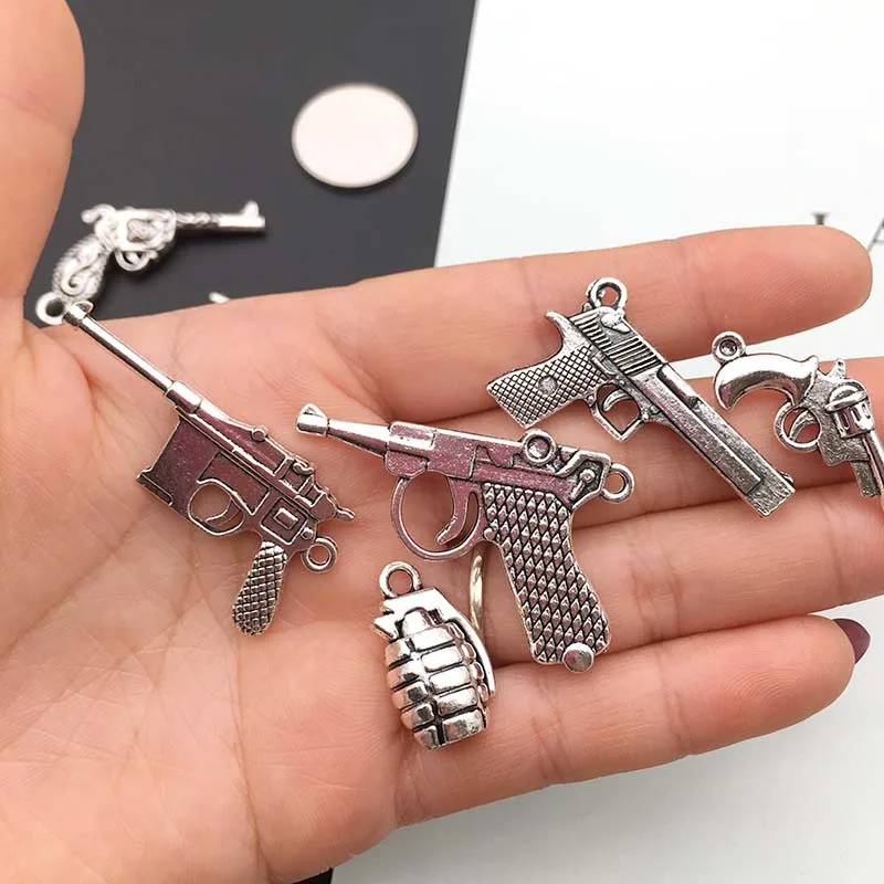 Manufacturers Wholesale DIY vintage alloy jewelry accessories silver guns weapons bullets necklaces bracelets pendants