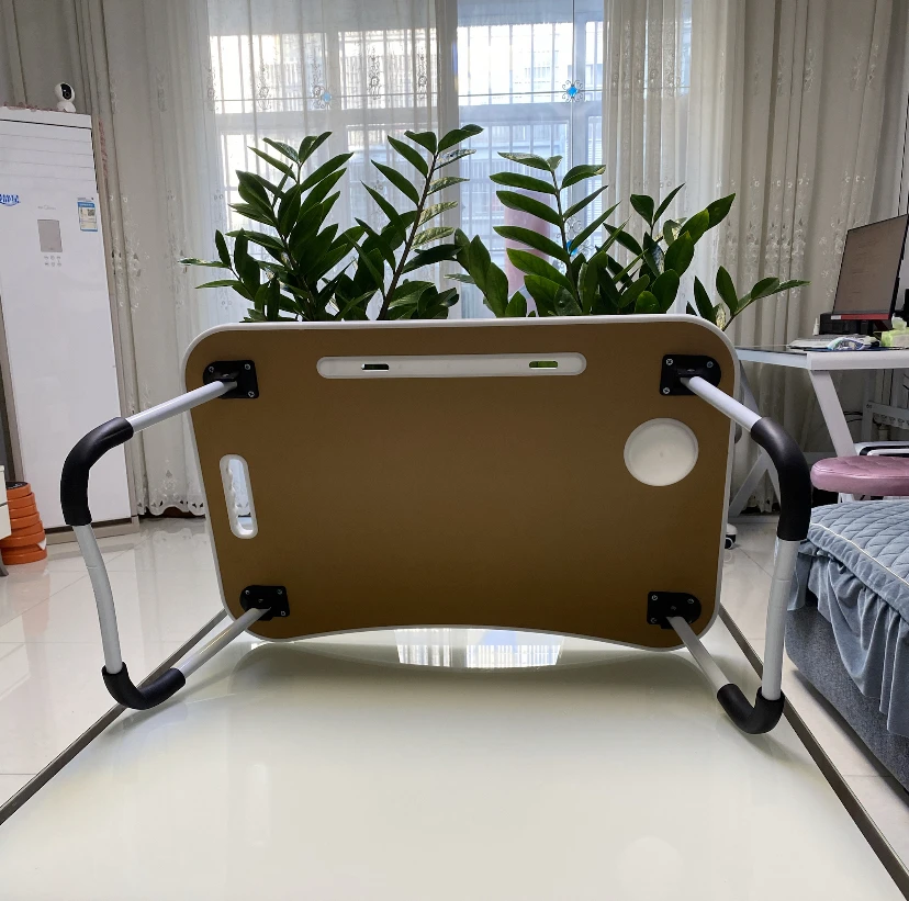 Portable and adjustable Mac laptop bed stand desk laptop desk suitable for home work travel and comes with a cup holder
