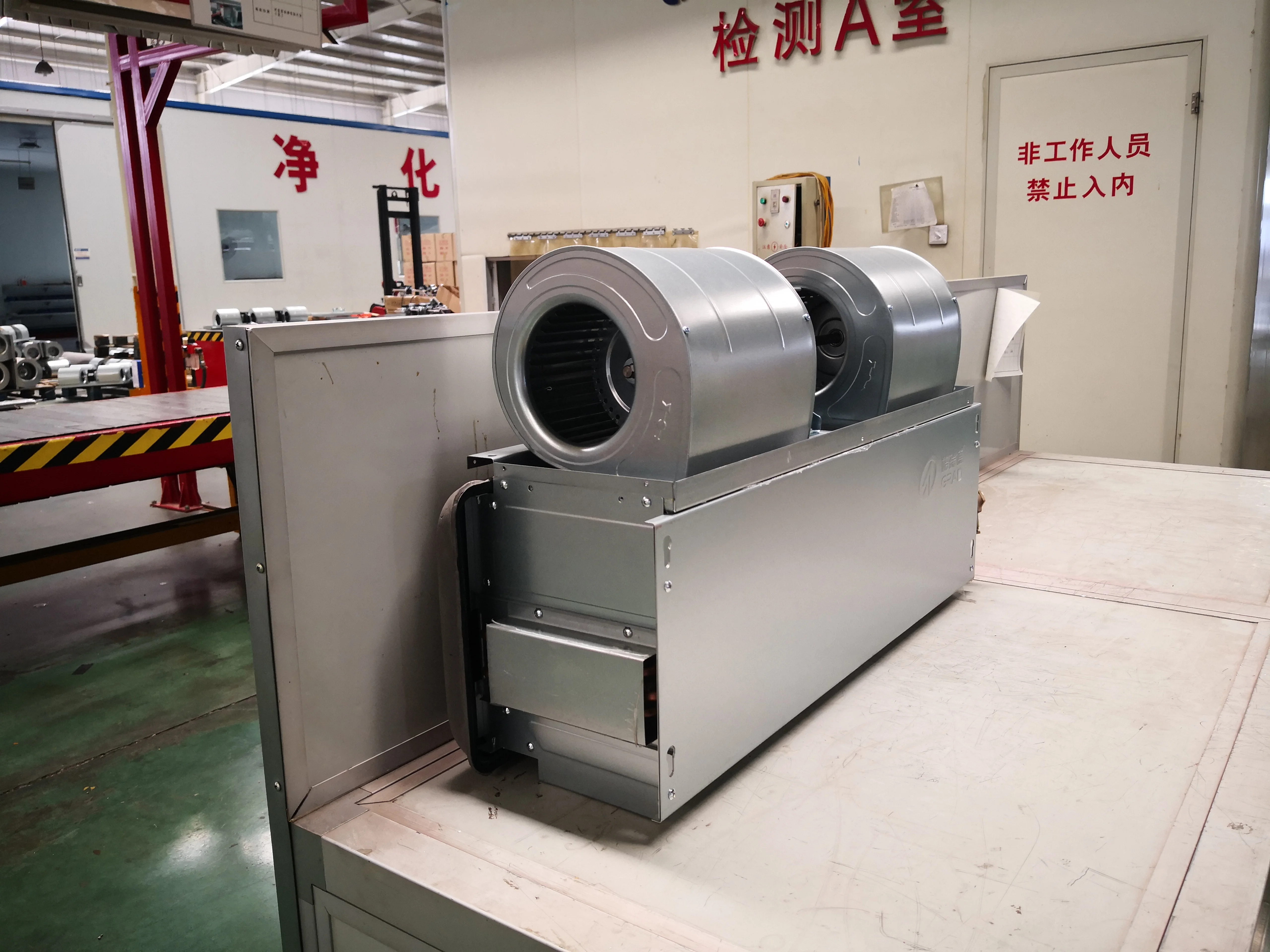 Ceiling mounted heating and cooling fan coil