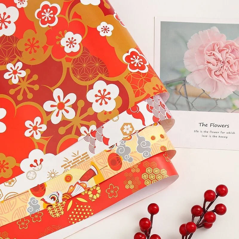 Wholesale cheap spot 130gHappy Red New Year Asian plum blossom lion dance auspicious cloud New Year gift gift paper 50x80cm