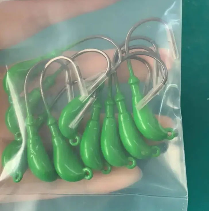 Wholesale fishing lures banana jigs head mustad hooks for sale