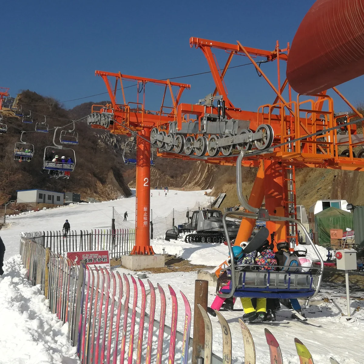 Ropeway chairlift with  four seats for four persons one chair  in ski resort ski area