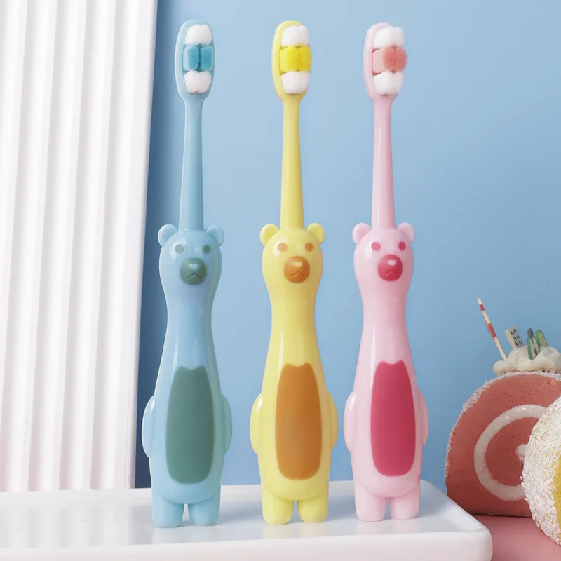 Wholesale OEM child kids silicone BPA free white bear cartoon 10000 PBT soft bristles portable travel manual toothbrush