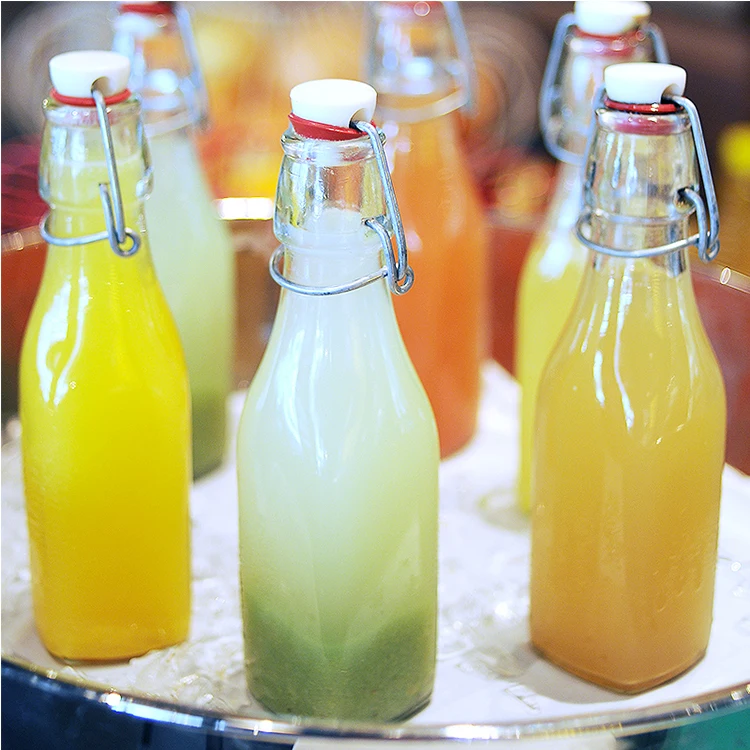 Cheap Wholesale 250/500/750/1000ml transparent swing top glass bottle with stopper for home brewing beverage juice