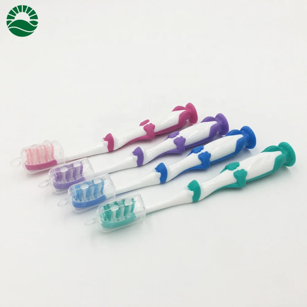 Cute dragon kids personalized toothbrush with suction bottom end round tooth brush