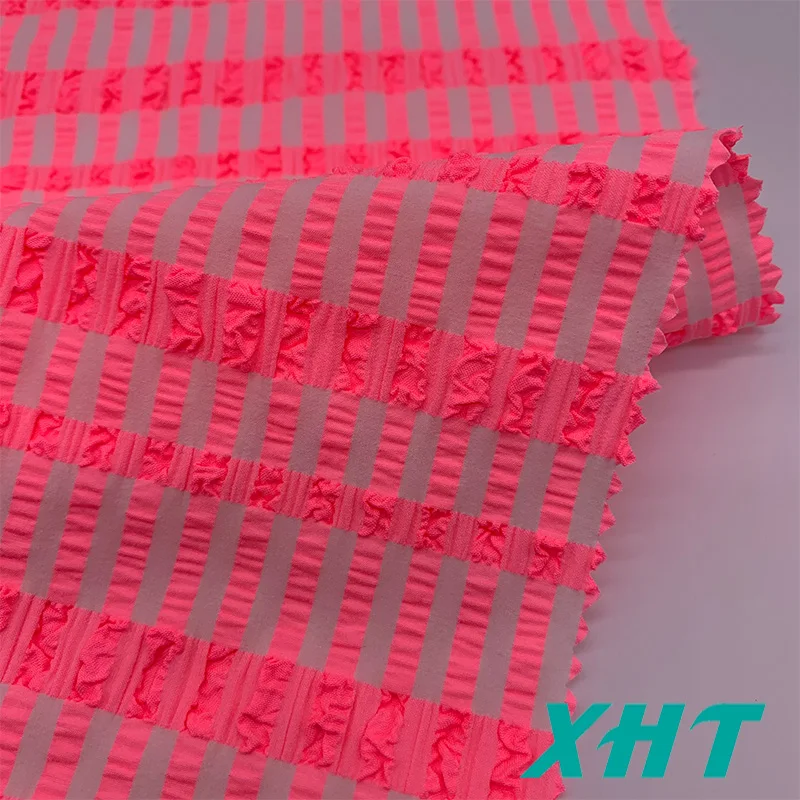 Hot selling customized color 4 way stretch woven Jacquard seersucker swimwear fabric