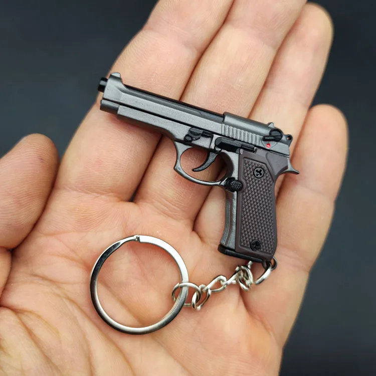 Hot selling Beretta M92 Bullet Shooting Toy Prop Gun Model Disassembled Real Simulation Bullet Pistol Toys Gun Keychain for Kids