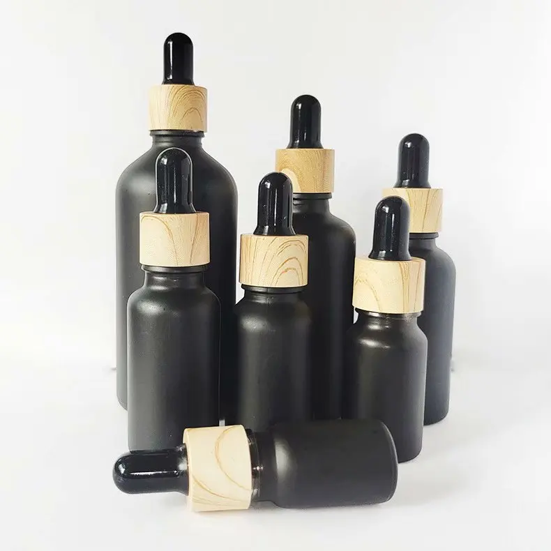 Best selling 30ml black frosted cosmetic bottle essential oil bottle with measurement pipette and paper tube packaging