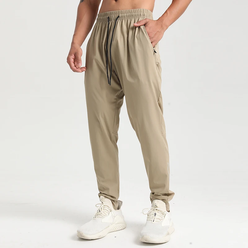 Factory direct sales four solid color blank trousers with drawstring texture quick dry fabric zipper pocket sweatpants men