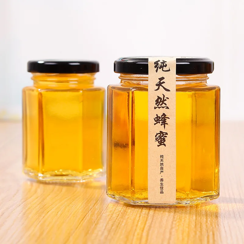 High Quality Hexagon Thickened Transparent Food Storage Jars Of Different Sizes Glass Honey Jars With Sealed Metal Lids