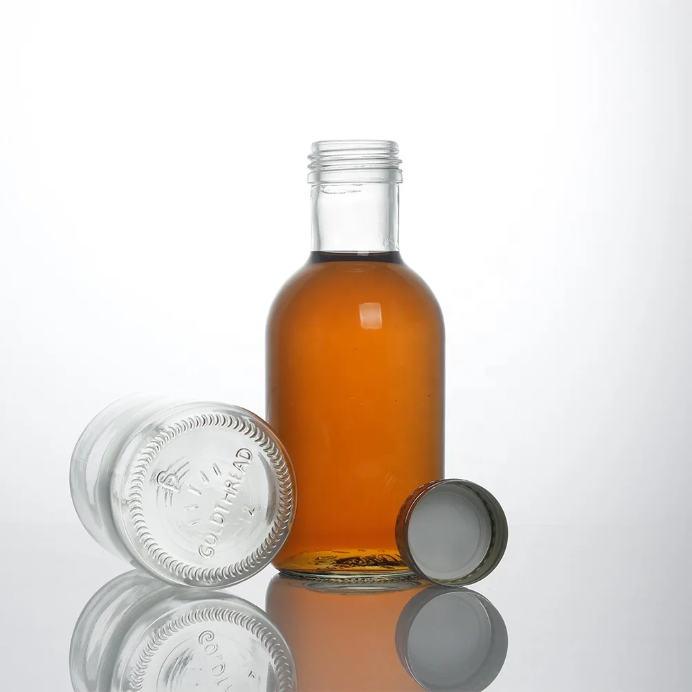 Stocked round clear empty 350ml glass bottle for beverage drinks 120oz fruit juice glass bottle