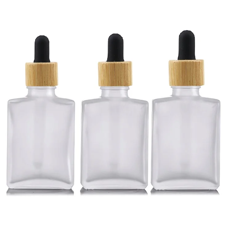 Popular empty clear flat square rectangle 1oz 30 ml Cosmetic  Glass Dropper oil Serum Bottle 30ml with Bamboo Cap