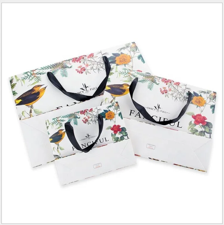 Wholesale custom printed luxury shopping gift paper bag with handle