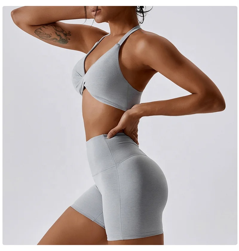 OEM Sportswear Custom Logo New Arrival Women Padded Nude Yoga Hanging Neck Twisted  Bra Fitness Sexy Blank Sports Bra For Women