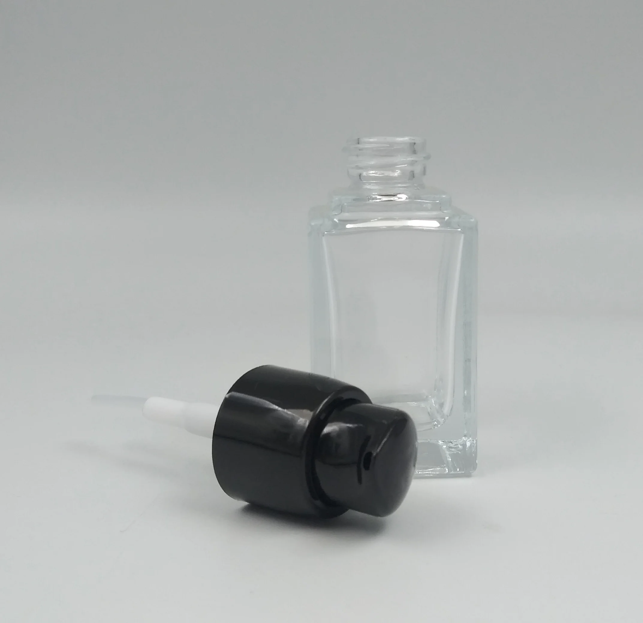 Wholesale new product Clear rectangle bird black pump 30ml 1 oz skin care lotion glass bottle