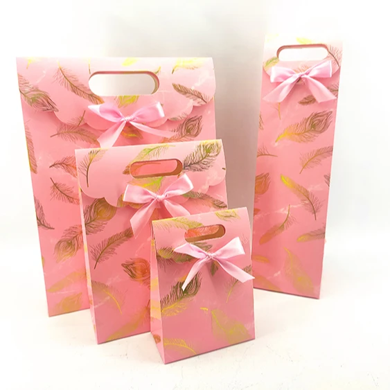 
hand-held paper gift bags pink kraft paper packet 