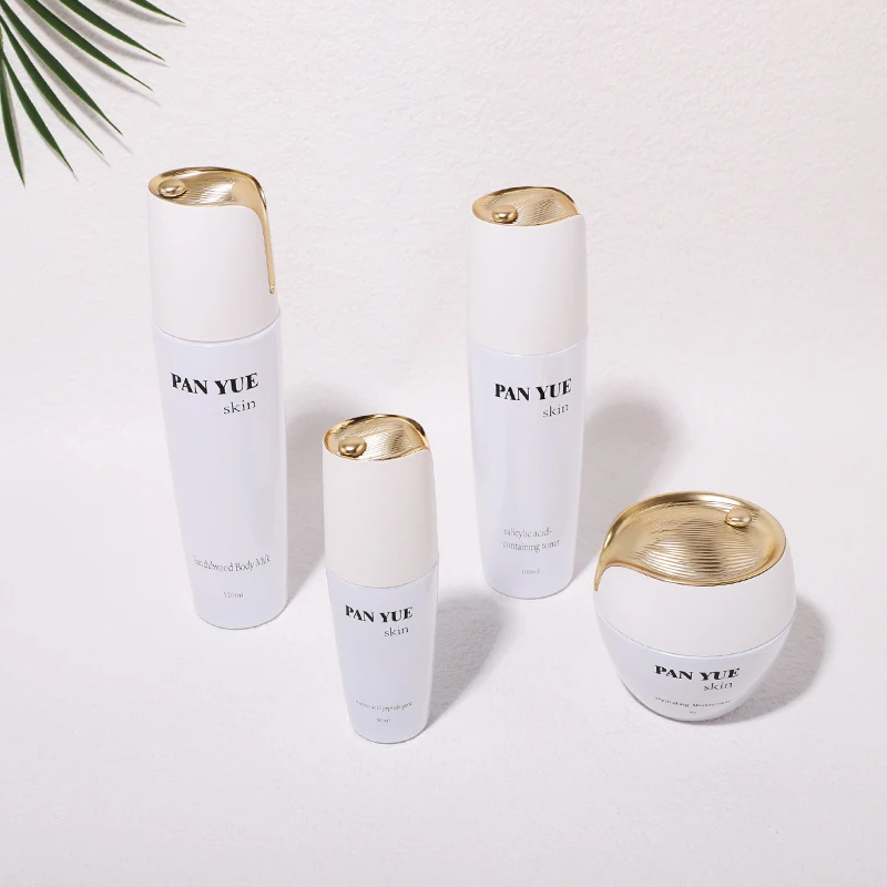 The latest lotus shaped empty glass bottle set with plastic plating lid for cosmetics skincare packaging wholesales