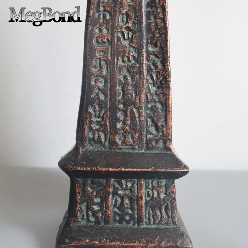 Antique bronze cast iron Egyptian traditional obelisk in metal material