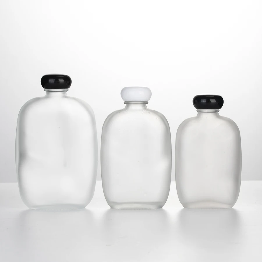 100 ml 200 ml Customized frosted empty cold brew coffee juice whisky glass bottles mini vodka glass bottles with screw cap