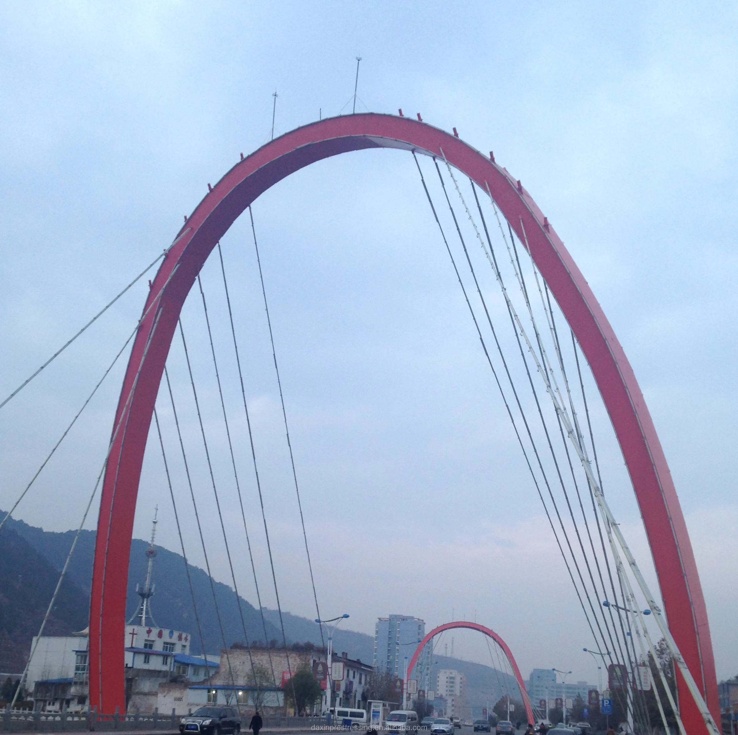 Vertical and inclined hangers with parallel strands for stayed cable bridge