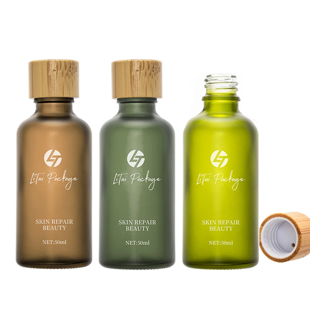 Custom 30ml 50ml 100ml amber glass bottle frosted green glass essential oil bottle with 18mm bamboo wooden screw cap