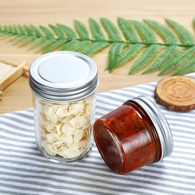 
High quality borosilicate airtight kitchen food cans round glass jam honey pickles jars with lids 