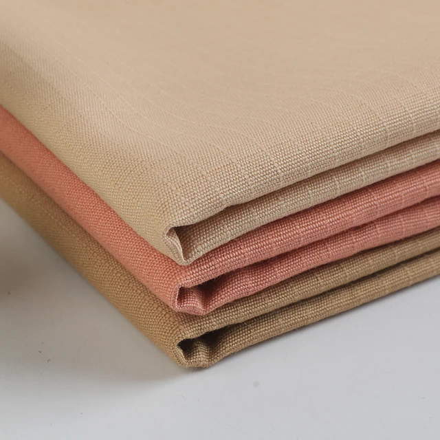 Wholesale plain-dyed woven thick strand beaded canvas lattice 100% cotton fabric for coat pants bags