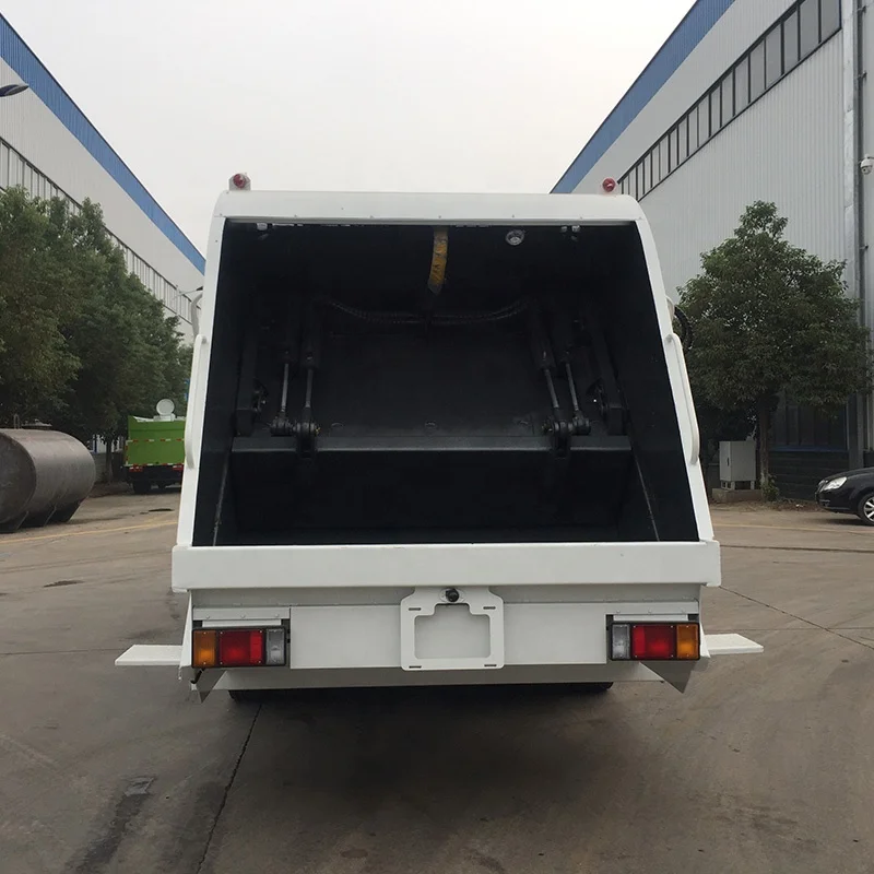 1SUZU ELF 4x2 Garbage Compactor Truck 7CBM Rear Loading Compression Garbage Truck for Sale