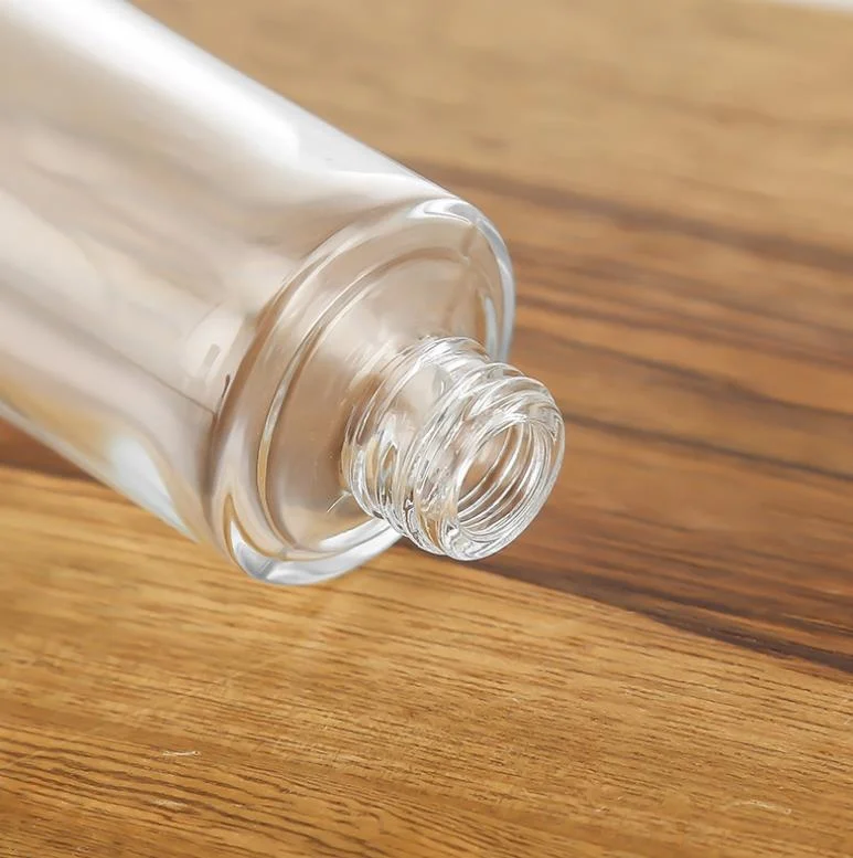 Luxury cosmetic packaging container clear glass packaging bottle with carved cover