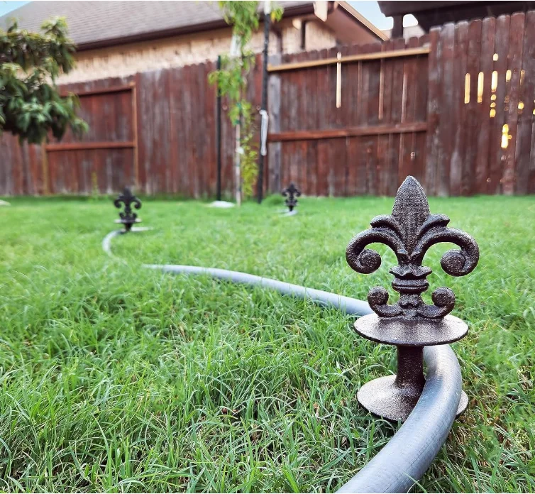 Antique Black Cast Iron Garden Strong and Decorative Hose Guide that Protects Your Plants and Provides Elegance to Your Garden