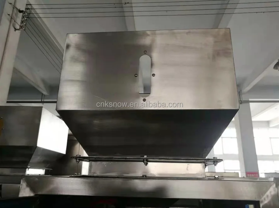 The manufacturer supplies a semi-automatic induction weighing 25Kg rice filling and packaging machine with a grain elevator