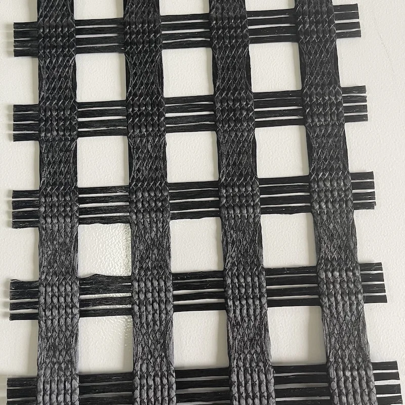 knitting woven coated PES PET polyester uniaxial road construction geogrid 450-50kn