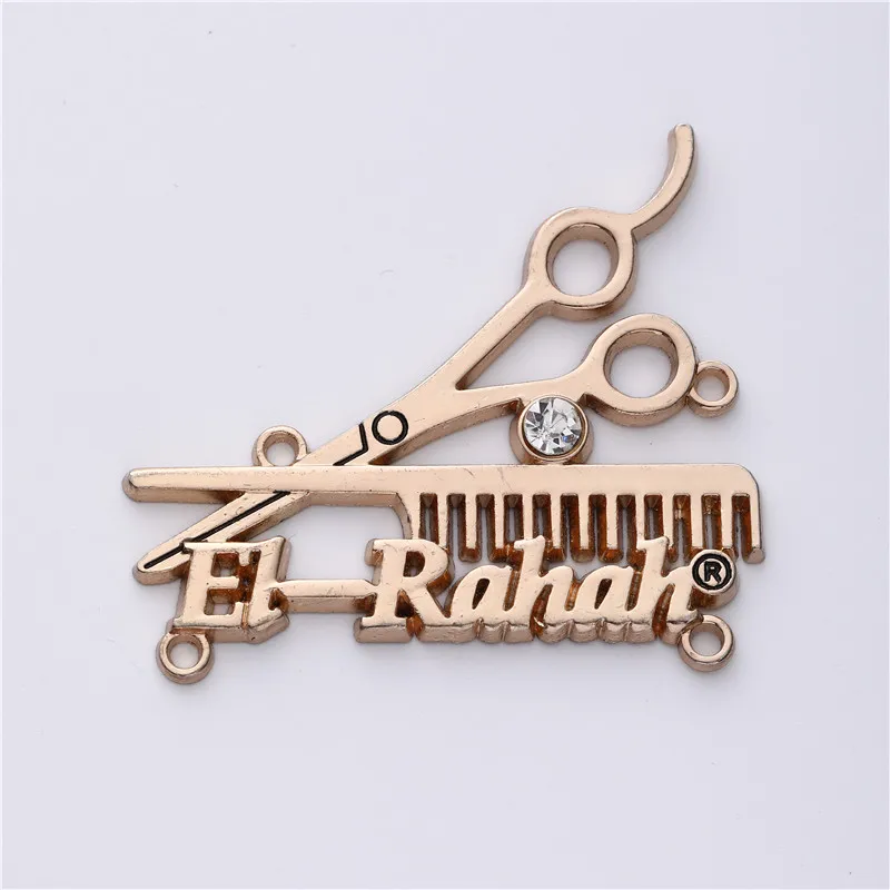 Wholesale Custom Shiny Gold Plated Low MOQ embossed Gold sewing Metal Label for clothing