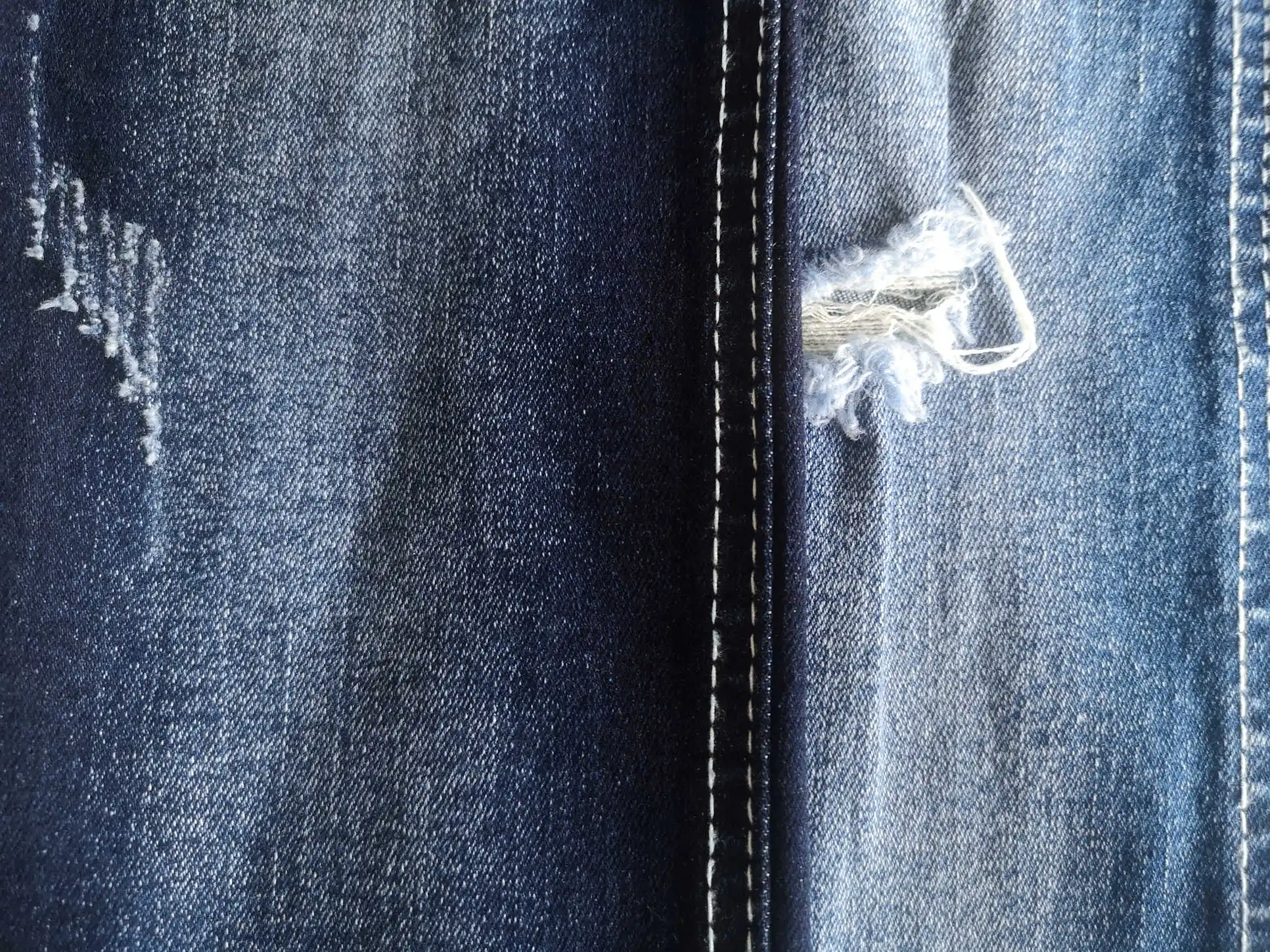 2549 Soft OE Foshan denim manufacturer raw material bull woven twill high stretch denim fabric for shiny jeans