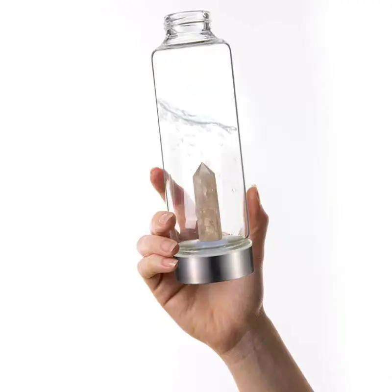 Glass Water Bottle With Rose Quartz Crystal on the Bottom
