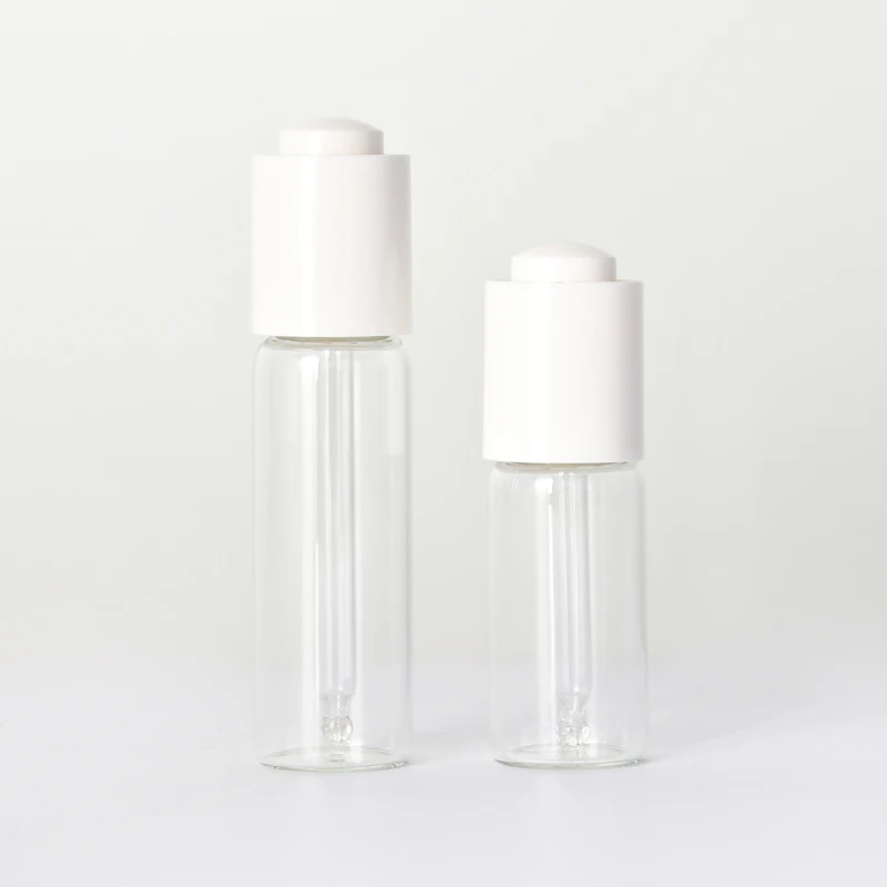 Transparent Skincare Packaging Glass Essential Oil Bottle with White Pressing Dropper