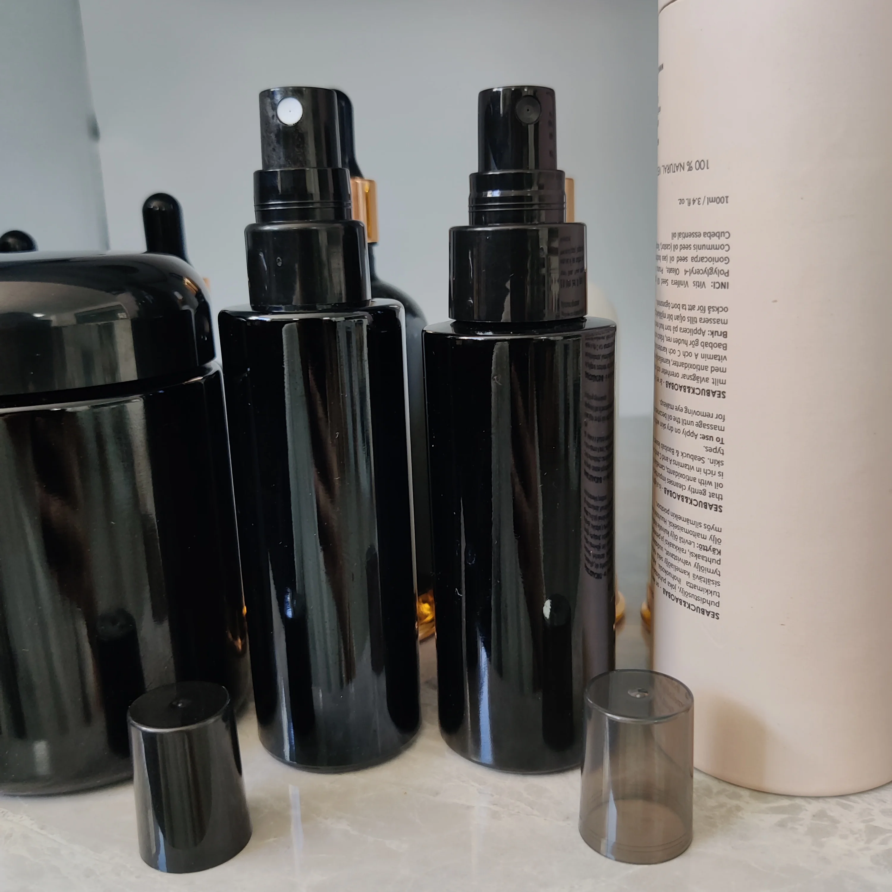 cosmetic packaging dark violet cylinder spray glass bottle