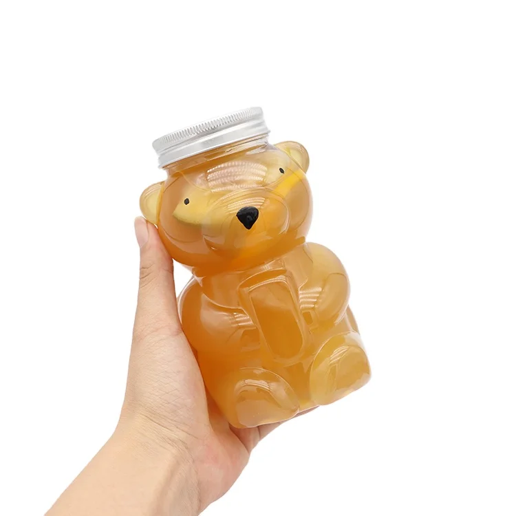 Bear-shaped PET plastic food storage Transparent cookie jar, food candy jar with lid plastic container Juice manufacturer