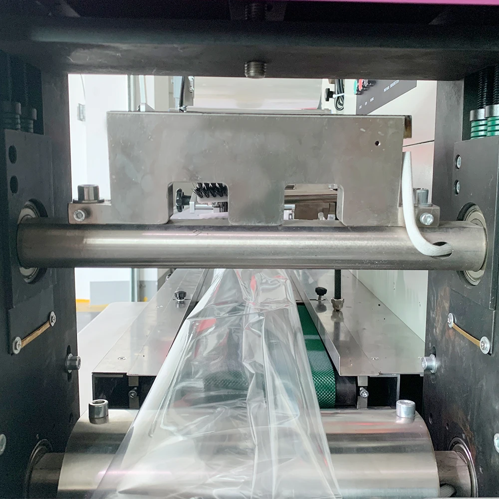 China Semi Automatic Bread Buns Packing Machine Suppliers Flow Pack Chocolate Packaging Machine