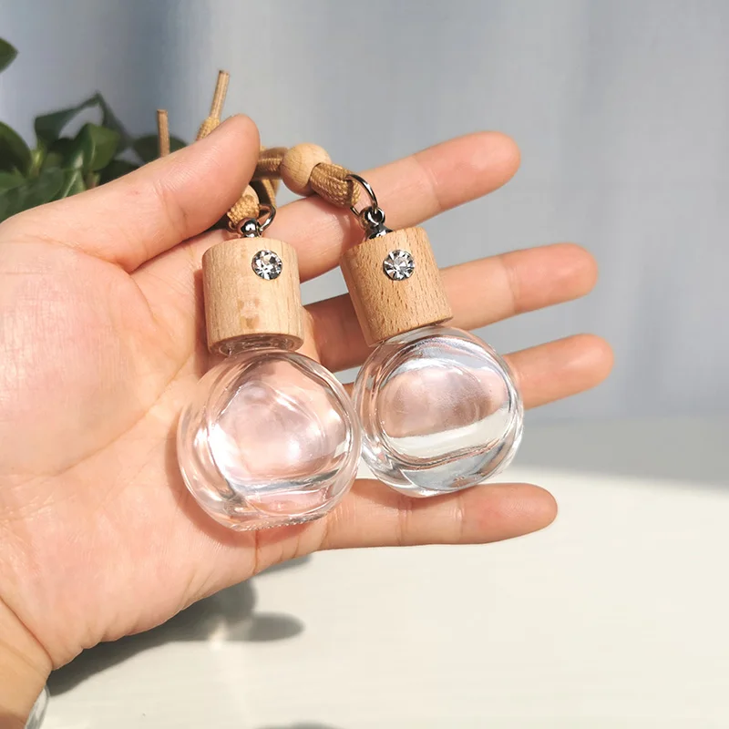Avertan wholesale 8ml Round shape  High Car Diffuser Perfume Glass Bottle With Hanging Ropes