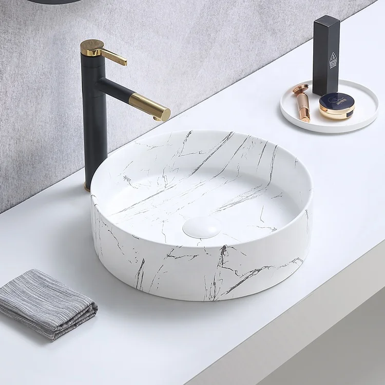 Элегантная настольная художественная раковина с каменным дизайном для ванной комнаты керамическая мраморным узором ручная