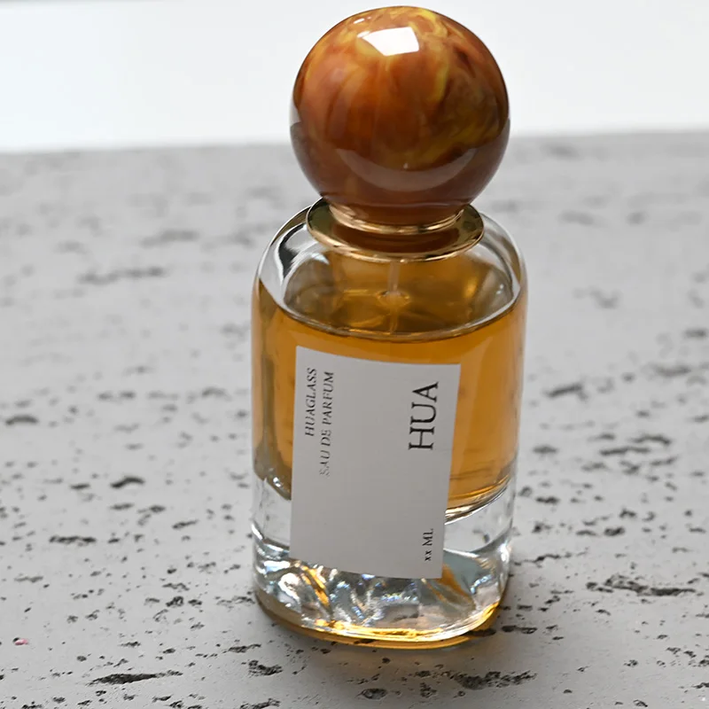 Luxury 50ml round glass perfume bottle with marble covered mountain bottom unique perfume bottle
