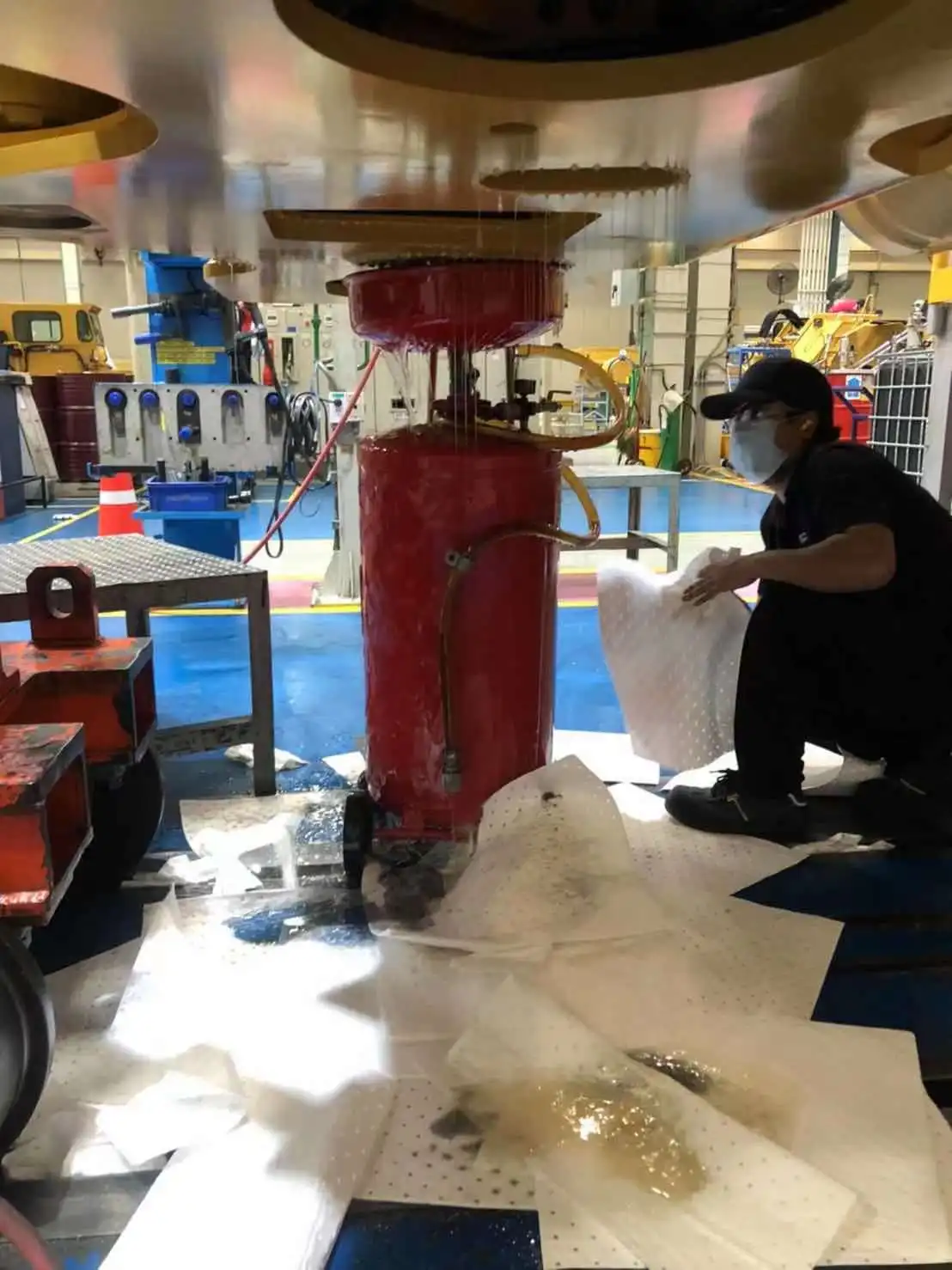 Perforated petroleum absorbent sheet for ocean oil spill cleanup