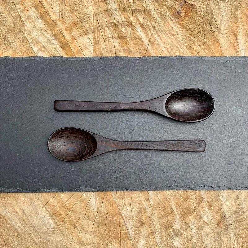 
Organic kitchen tools ice cream coconut shell bowls with wooden spoons 