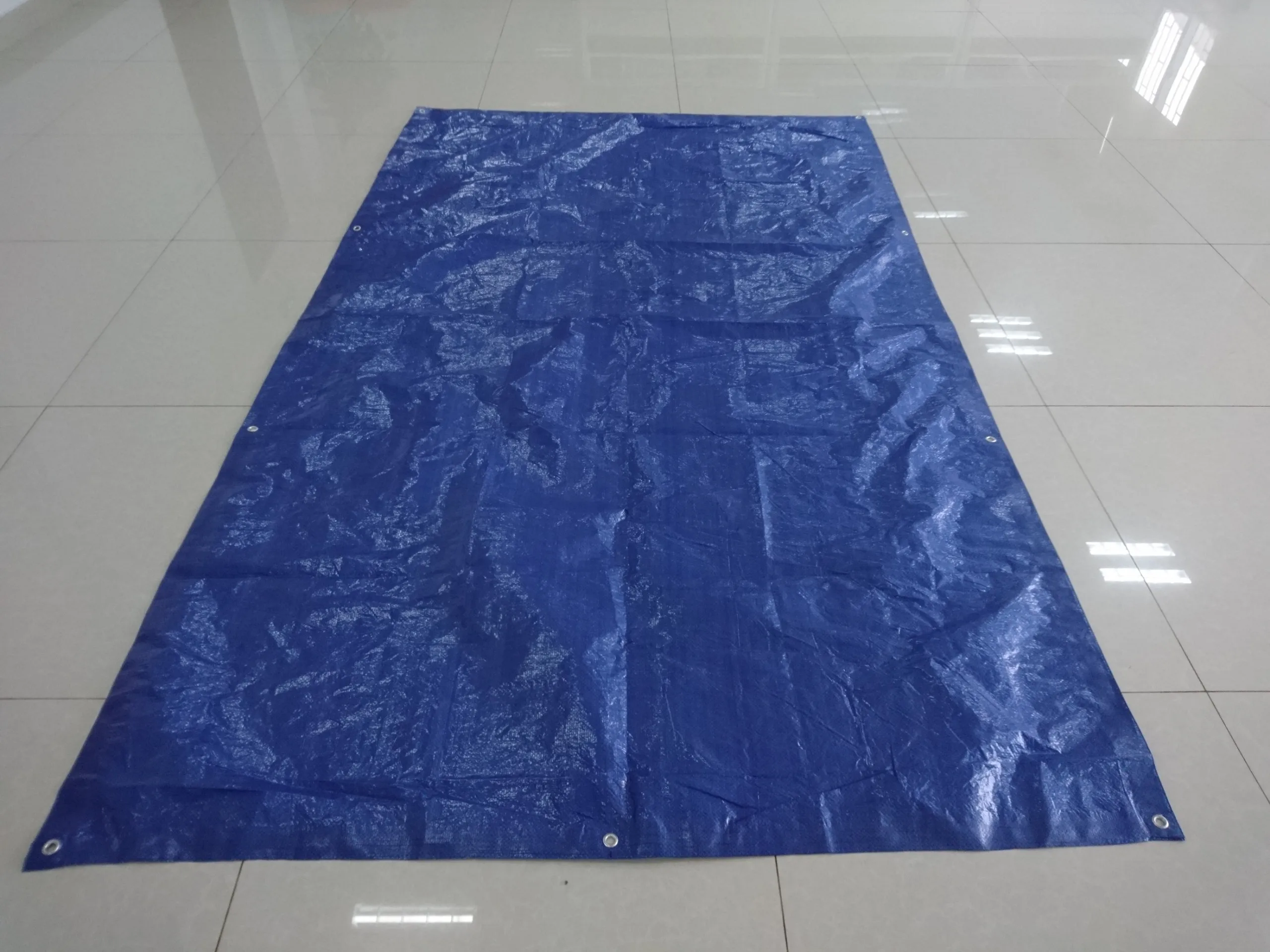 
PE Tarpaulin Sheet With Sides Heat Sealed and Aluminium Eyelets 