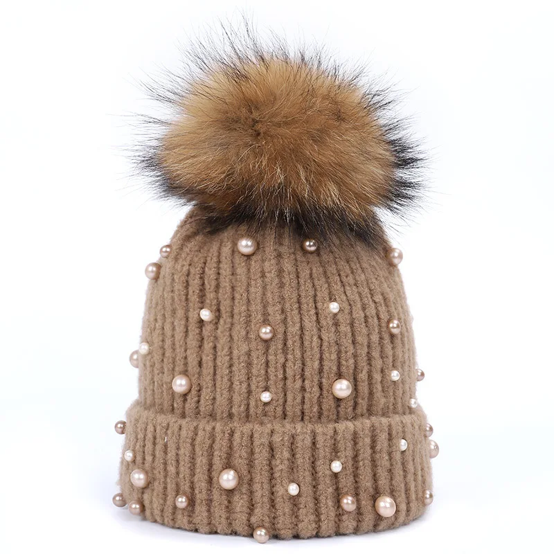 wholesale sale of knitted thermal giant raccoon fur ball hats for both men and women